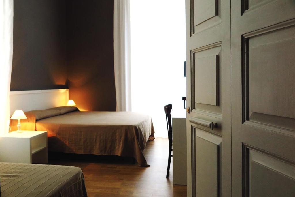 Postel nebo postele na pokoji v ubytování B&B In Centro