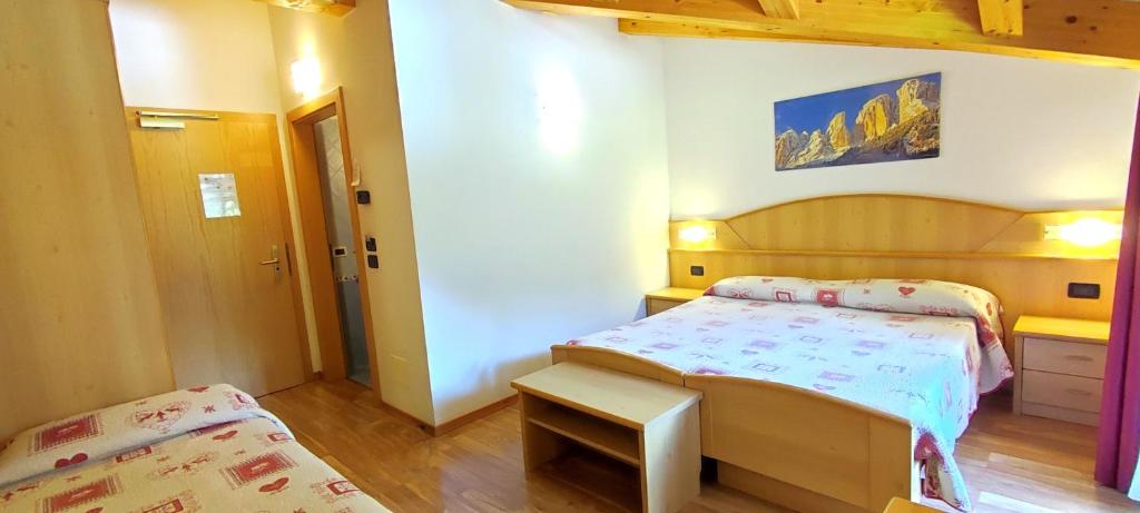 Postel nebo postele na pokoji v ubytování Hotel Miramonti