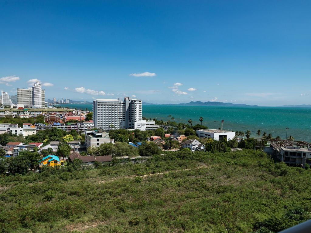 a view of a city with the ocean and buildings at Jomtien Beach Condominium S1 by Olga in Jomtien Beach