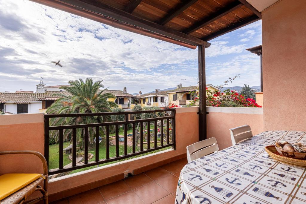 a balcony with a table and chairs and a view at Terrazza porto San Paolo in Porto San Paolo