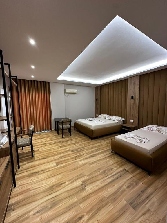 Postel nebo postele na pokoji v ubytování New Donantelo Hotel