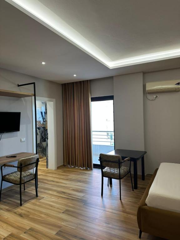 TV a/nebo společenská místnost v ubytování New Donantelo Hotel