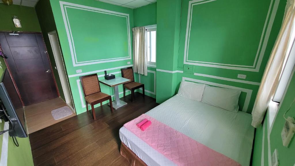 Postel nebo postele na pokoji v ubytování Lanyu Gulu Homestay