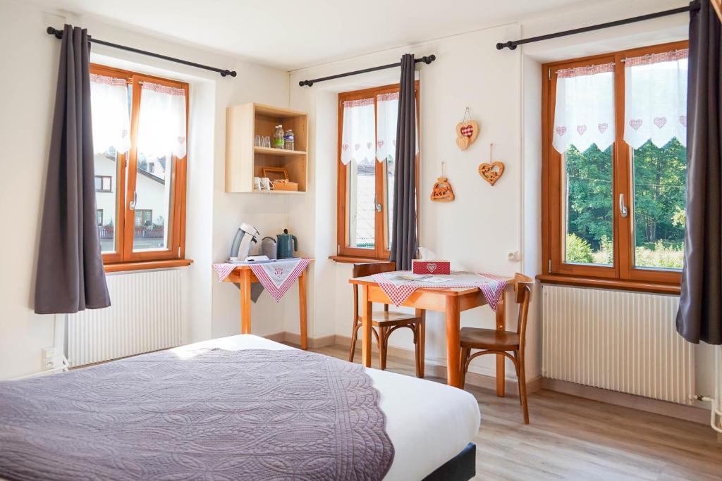 Postel nebo postele na pokoji v ubytování Chambres d'hôtes A la Fecht Nature et Bien-être