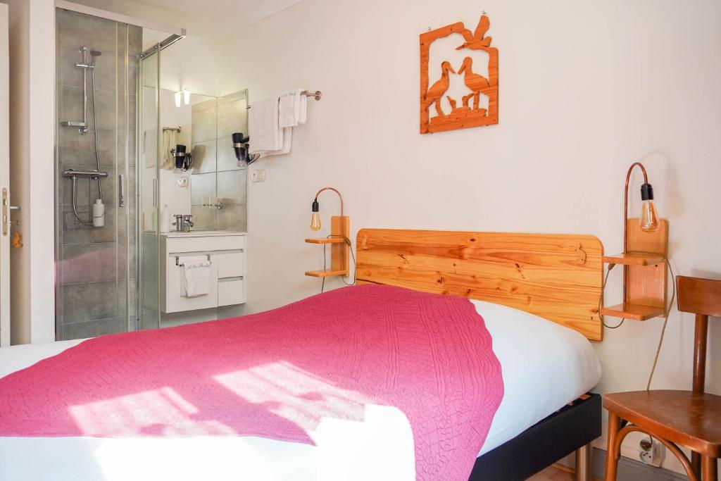 Postel nebo postele na pokoji v ubytování Chambres d'hôtes A la Fecht Nature et Bien-être