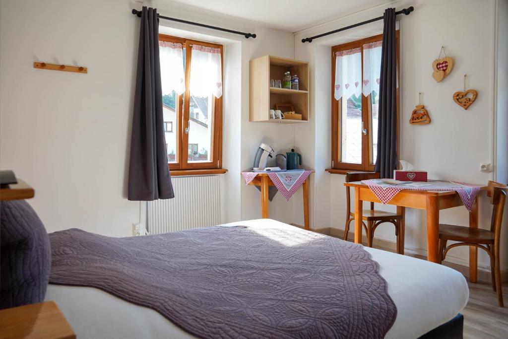 Postel nebo postele na pokoji v ubytování Chambres d'hôtes A la Fecht Nature et Bien-être