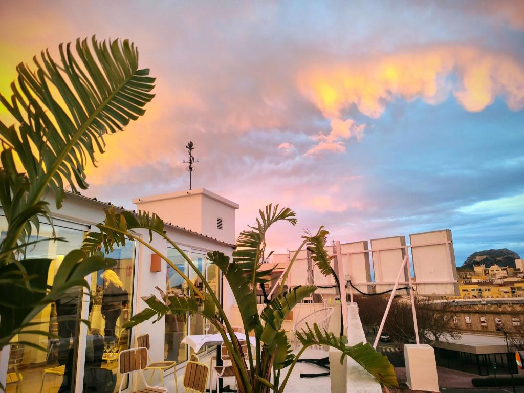 a view of a building with a rainbow in the sky at Hotel Ramis fundado en 1969 in Ondara