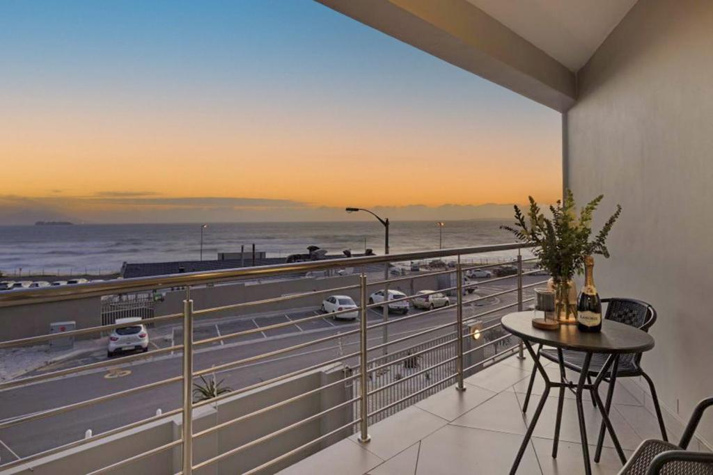 a balcony with a view of a highway at Sunset On Hill 3 in Bloubergstrand