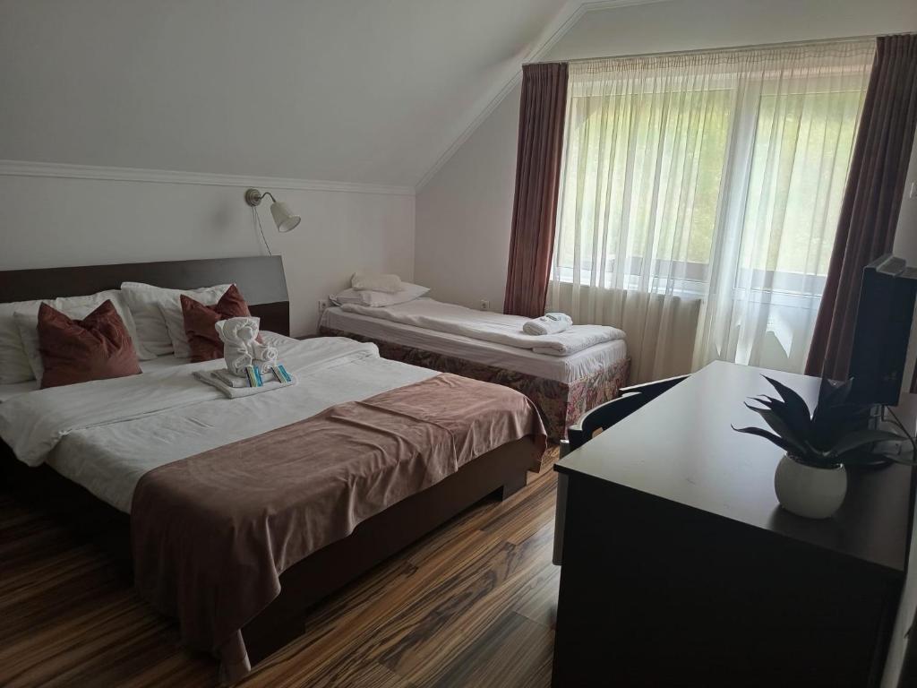 Postel nebo postele na pokoji v ubytování Vila Man