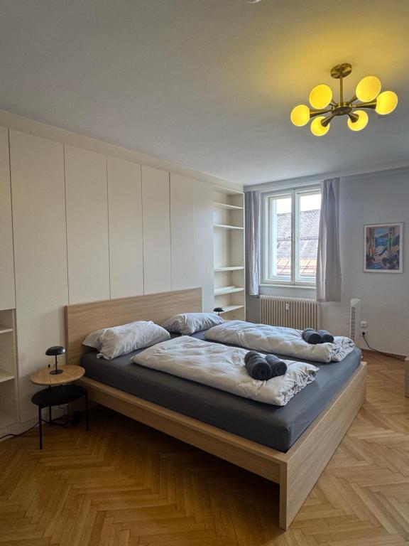 a bedroom with a large bed in a room at cozy big old town apartment in Klagenfurt