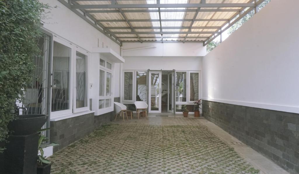 an empty hallway of a house with a ceiling at Kalyana Guest House in Bandung