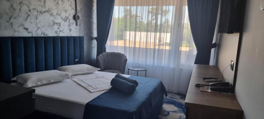 Postel nebo postele na pokoji v ubytování HOTEL TOPAZ 4* CAP AURORA