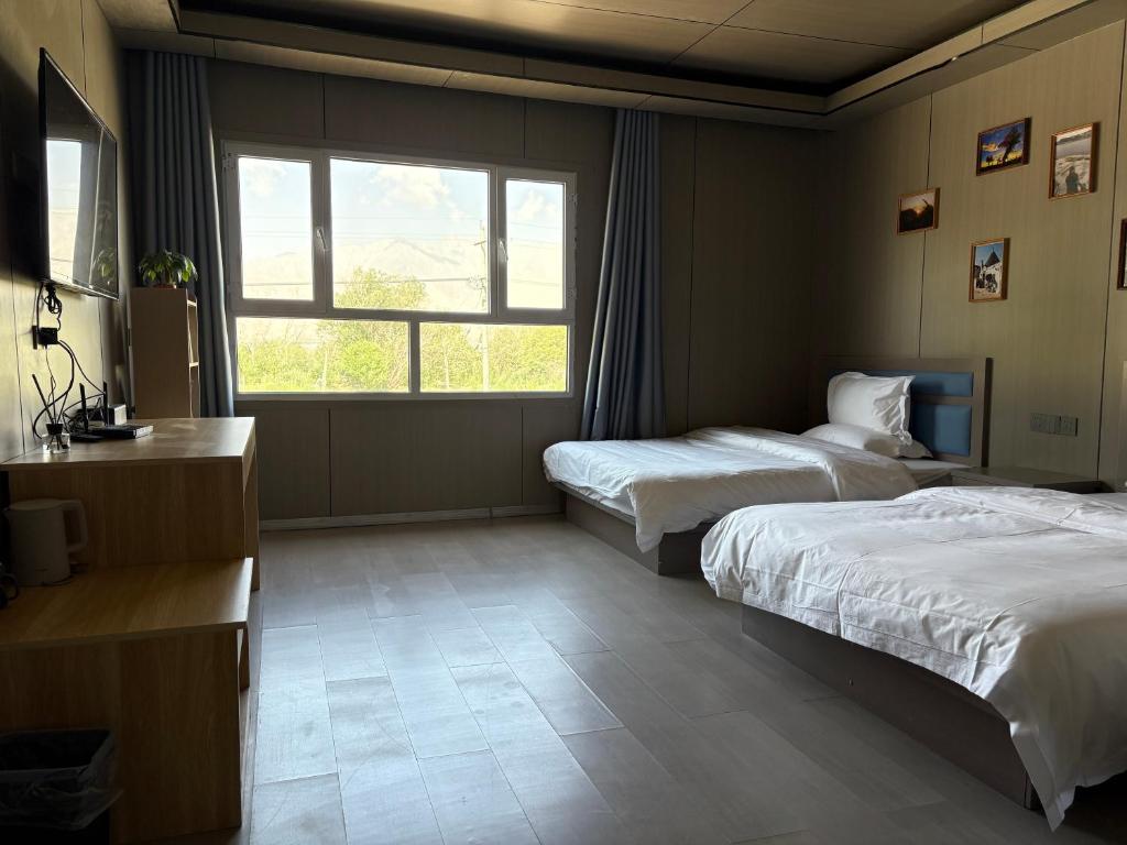 Postel nebo postele na pokoji v ubytování Fengchui Banxia Manor Wild Luxury Camp