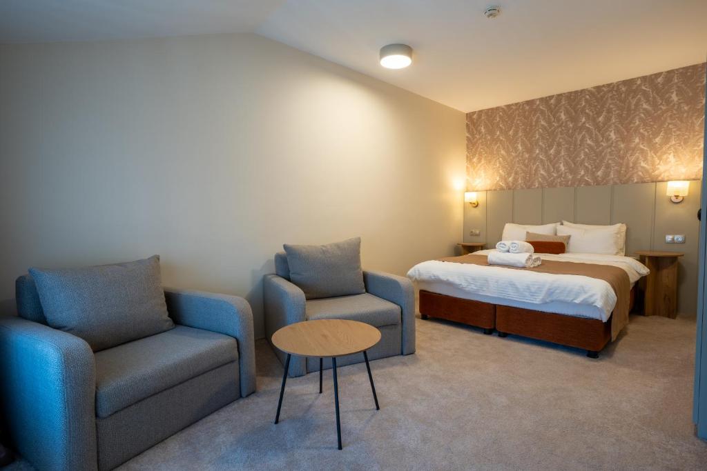 Postel nebo postele na pokoji v ubytování Saffron Boutique Hotel