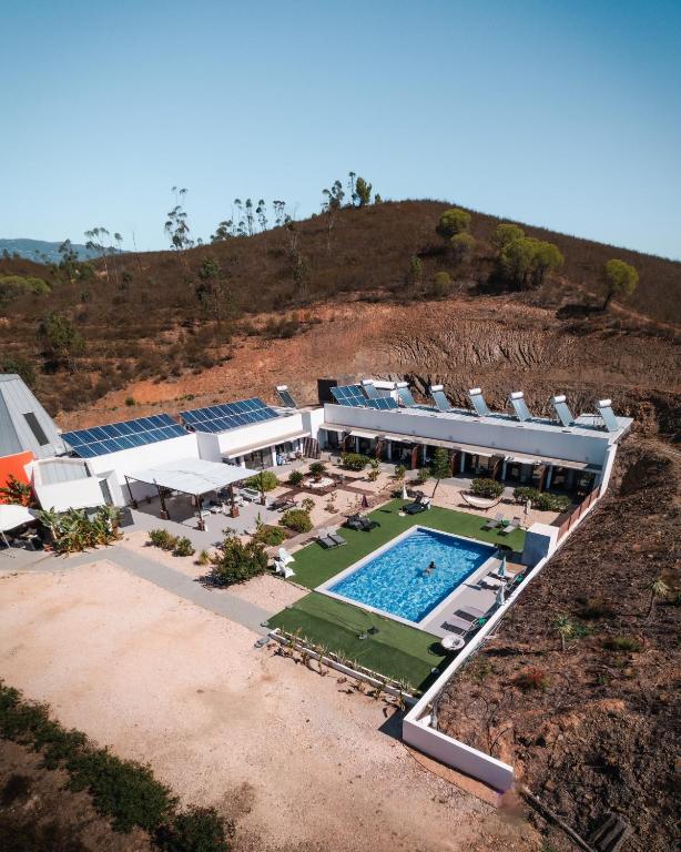 an aerial view of a house with a swimming pool at Villa Atitudo Nature in Portimão