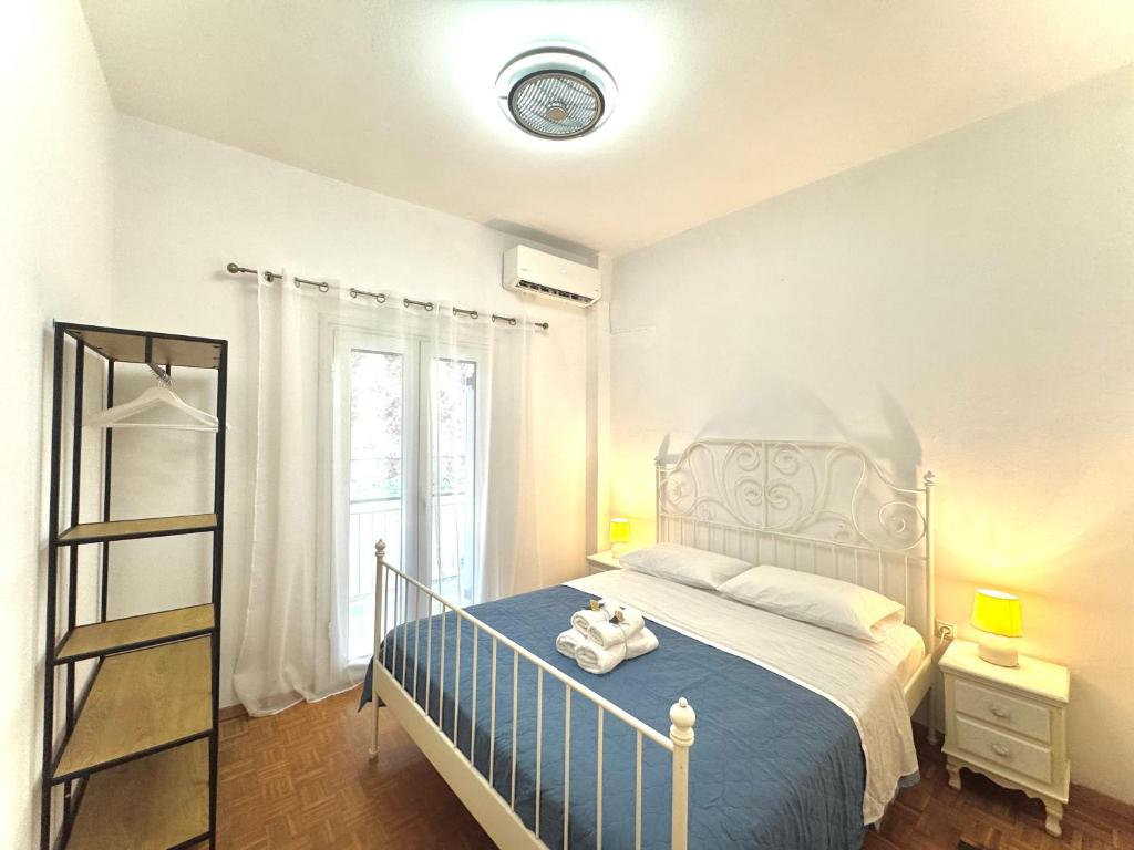 Postel nebo postele na pokoji v ubytování Nikos Apartment