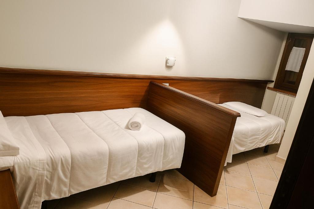 Postel nebo postele na pokoji v ubytování Albergo Reale