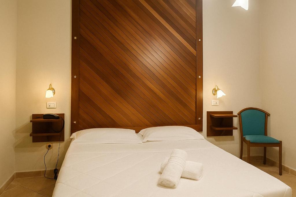 Postel nebo postele na pokoji v ubytování Albergo Reale