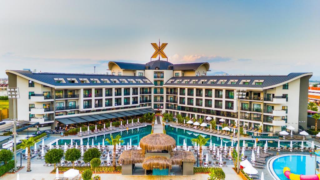 a hotel with a pool and a resort at The X Belek in Belek