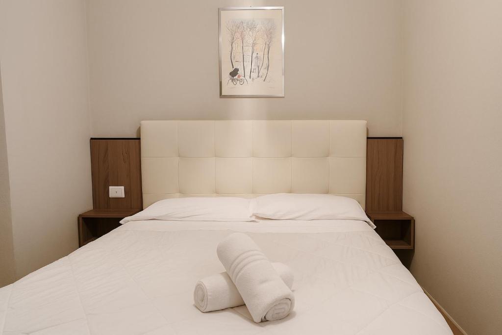 Postel nebo postele na pokoji v ubytování Albergo Reale