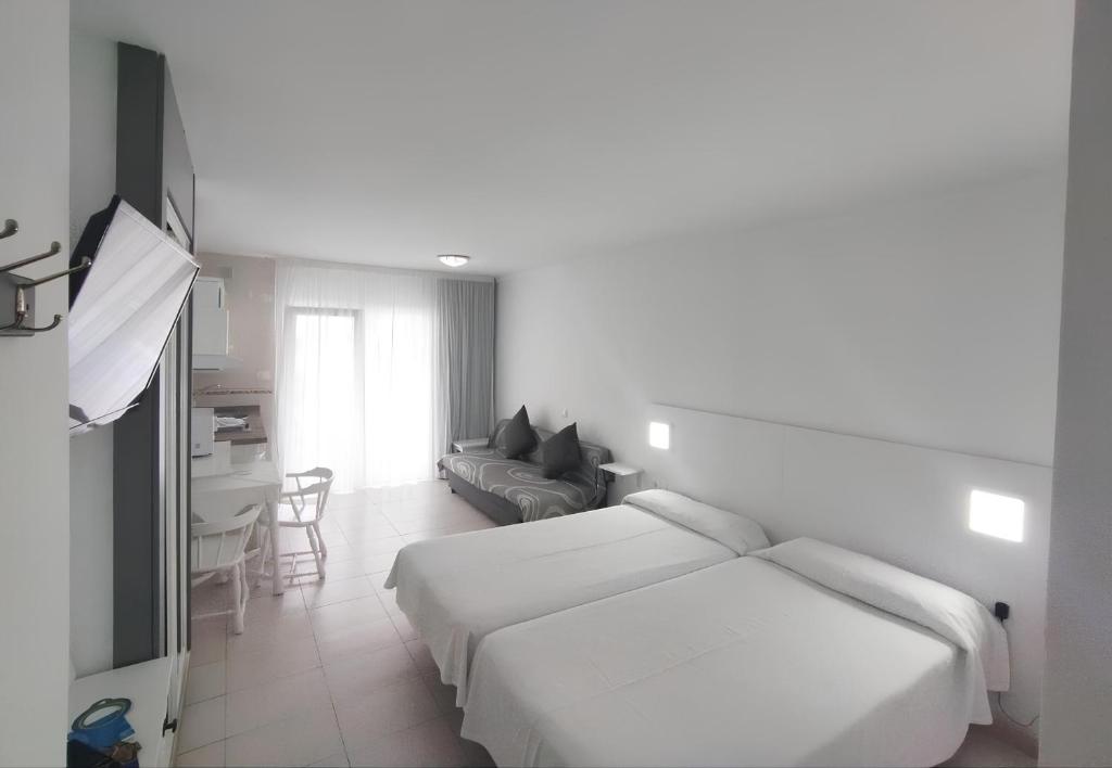 Katil atau katil-katil dalam bilik di Precioso Estudio hasta 3 pax en Puerto de la Cruz