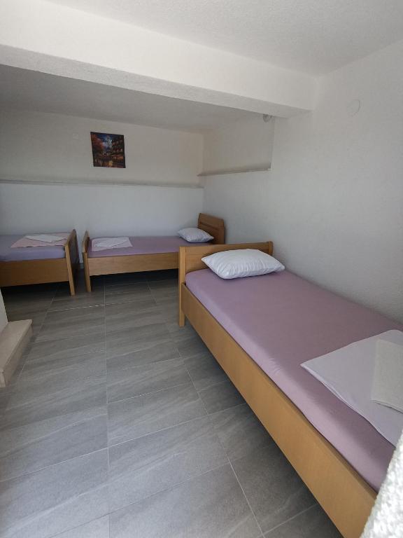 Postel nebo postele na pokoji v ubytování Apartmani Neum