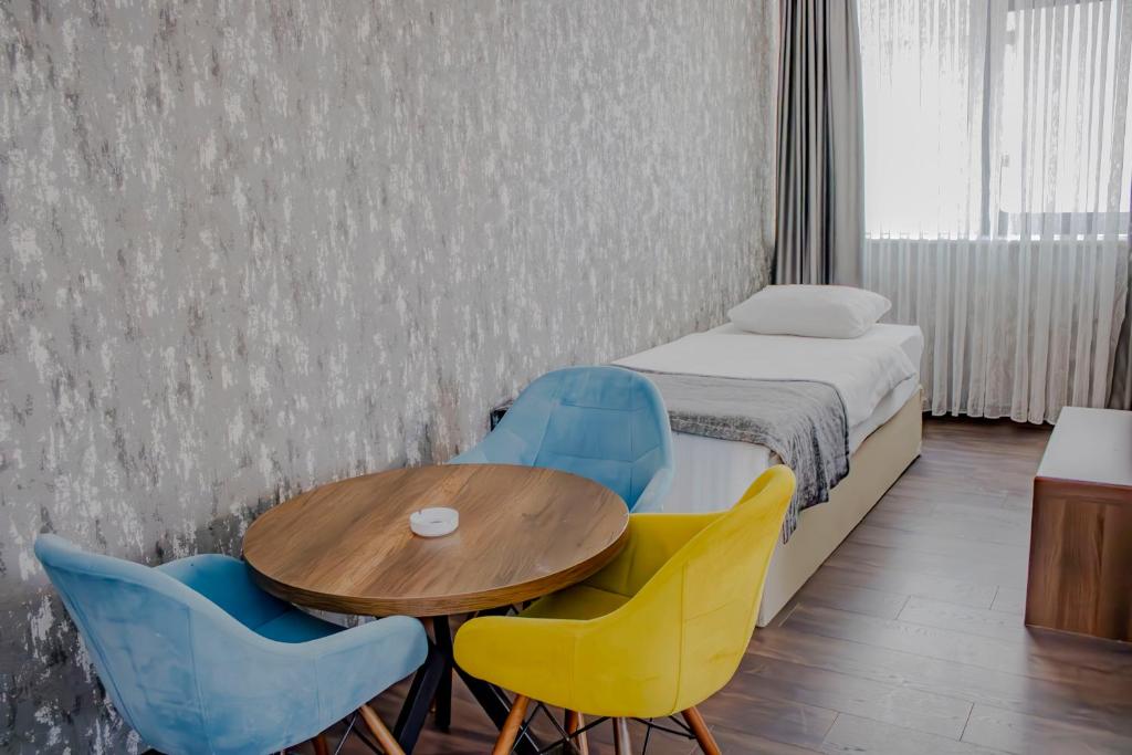 Postel nebo postele na pokoji v ubytování Ma City Hotel