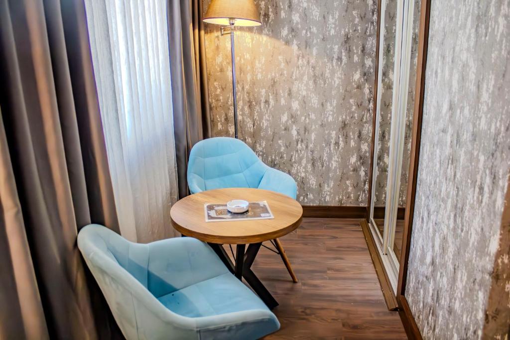 Posezení v ubytování Ma City Hotel