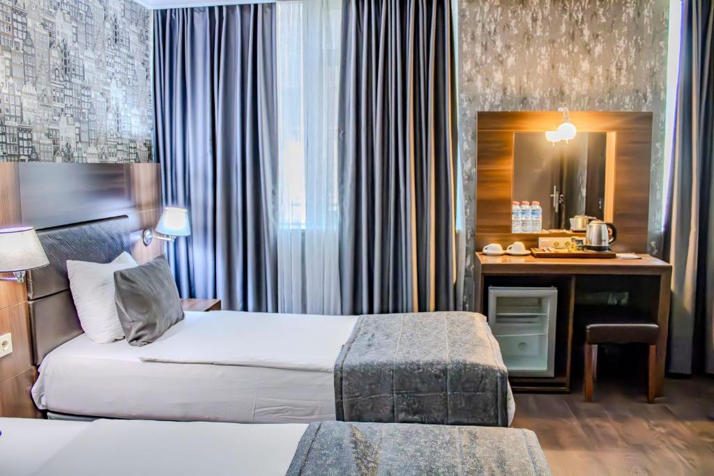 Postel nebo postele na pokoji v ubytování Ma City Hotel