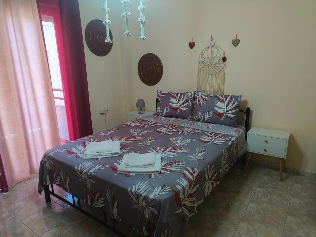 a bedroom with a bed with two plates on it at Vaso holidays in Alexandroupoli