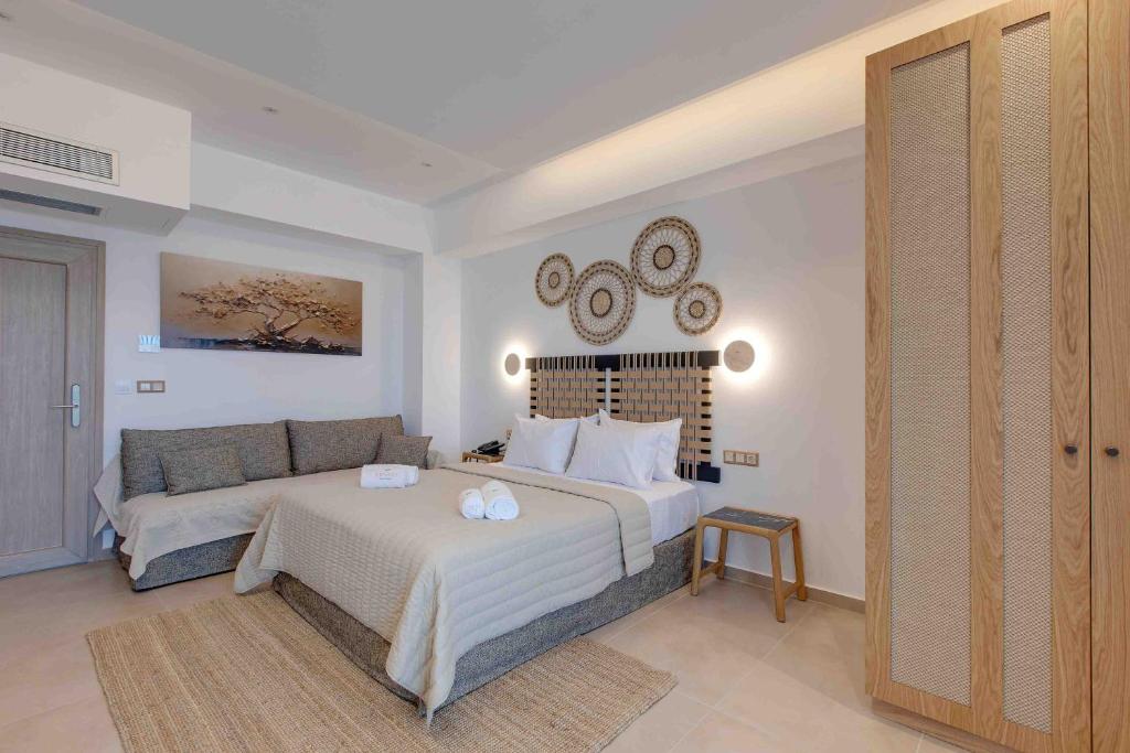 Postel nebo postele na pokoji v ubytování Linari Sea & Suites