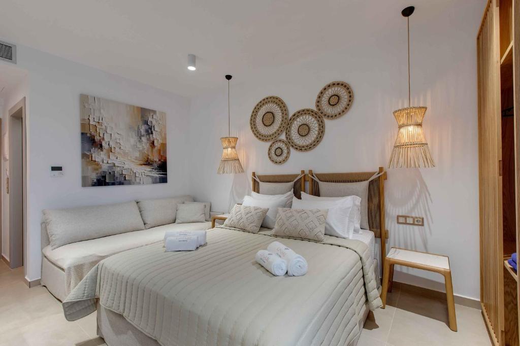 Postel nebo postele na pokoji v ubytování Linari Sea & Suites