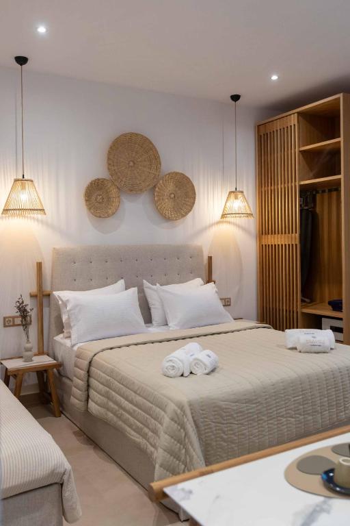Postel nebo postele na pokoji v ubytování Linari Sea & Suites