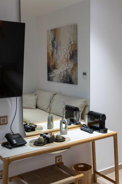 TV a/nebo společenská místnost v ubytování Linari Sea & Suites