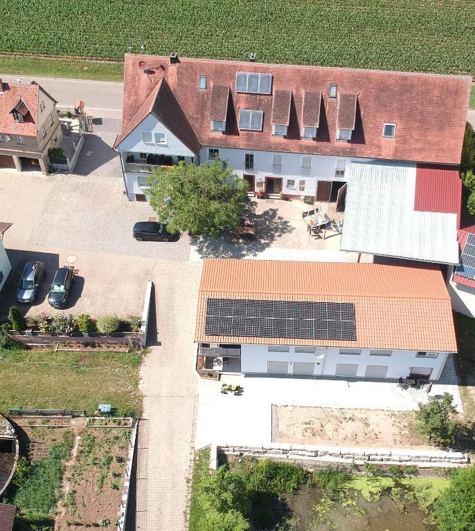an overhead view of a house with solar panels on its roof at Ferienwohnungen Meyer in Heilsbronn
