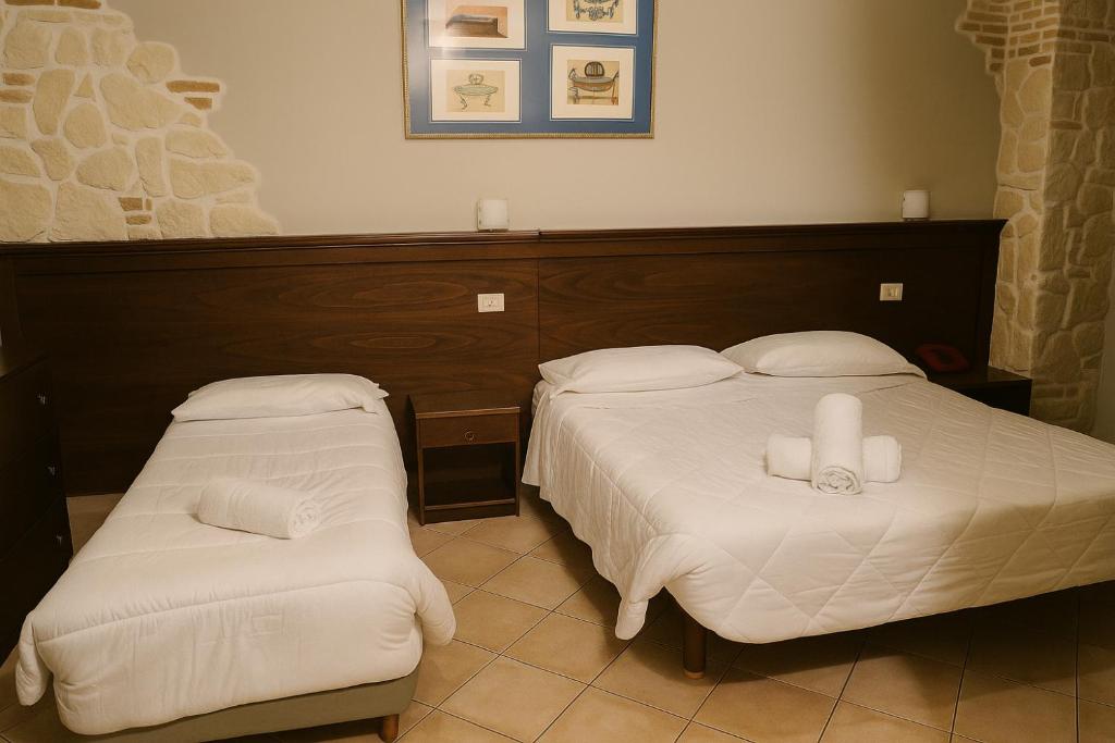 Postel nebo postele na pokoji v ubytování Albergo Reale