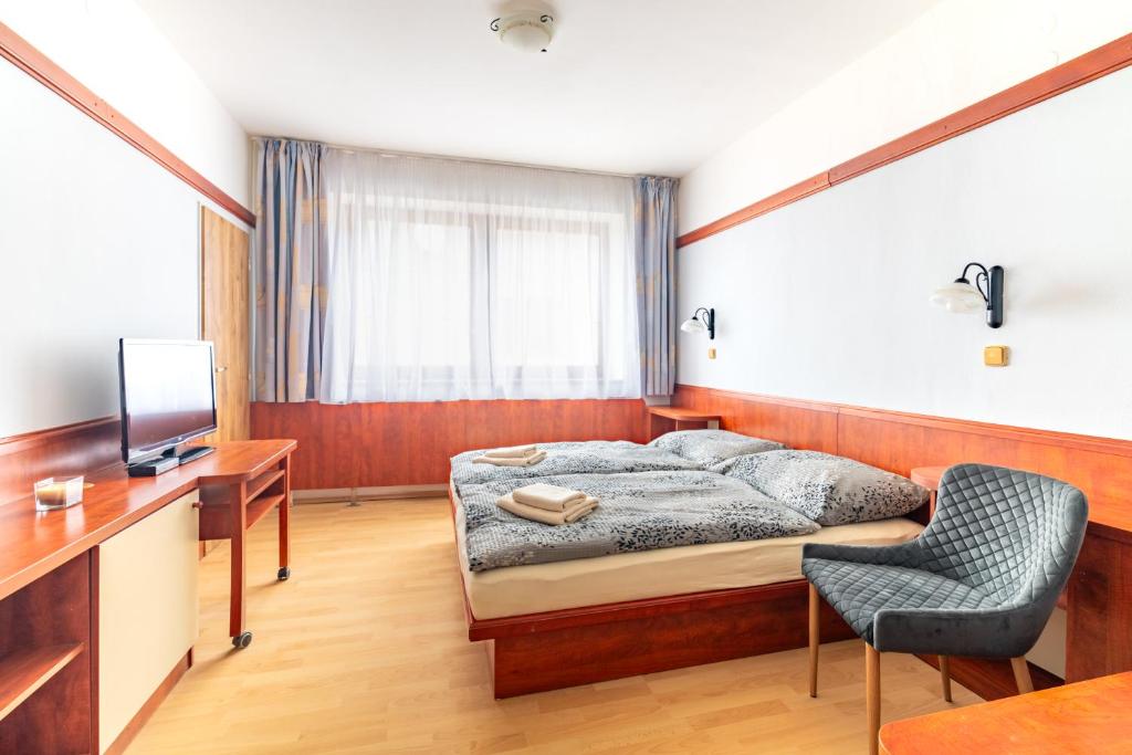 TV a/nebo společenská místnost v ubytování Hotel Macocha