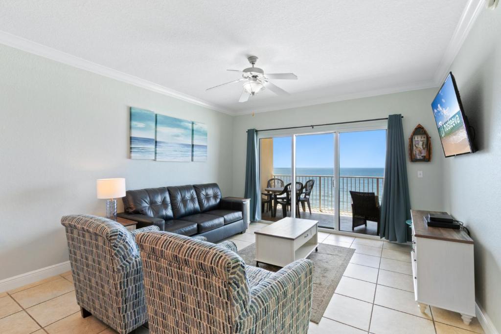 a living room with a couch and a table at Crystal Shores West Condos in Gulf Shores