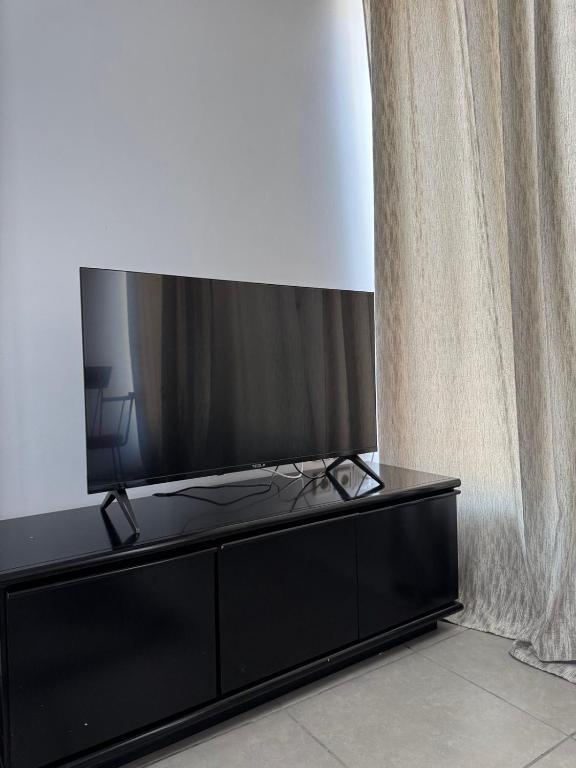 TV a/nebo společenská místnost v ubytování Mezzanine