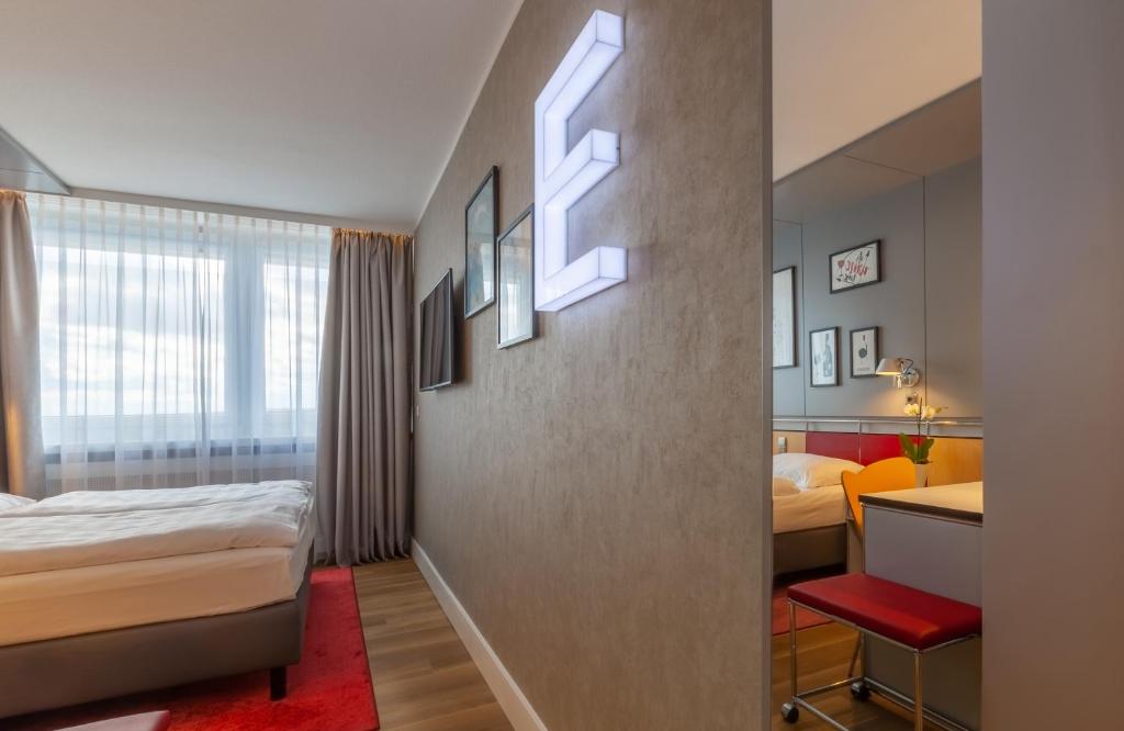 Postel nebo postele na pokoji v ubytování NYX Hotel Erfurt by Leonardo Hotels