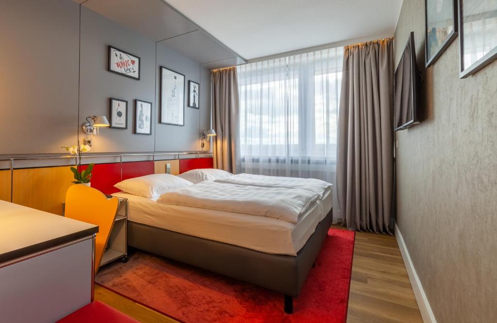 Postel nebo postele na pokoji v ubytování NYX Hotel Erfurt by Leonardo Hotels