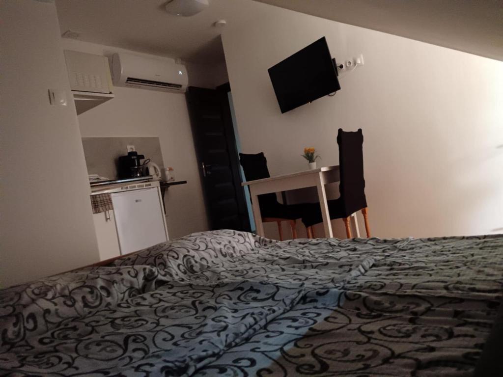 Postel nebo postele na pokoji v ubytování Babilon Gyula Szállás De Luxe