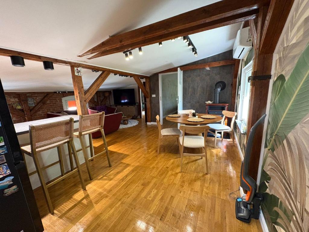 a living room and dining room with a table and chairs at Apartament Wojciecha 9B 4 - Gdynia Śródmieście 70m2 Górne in Gdynia