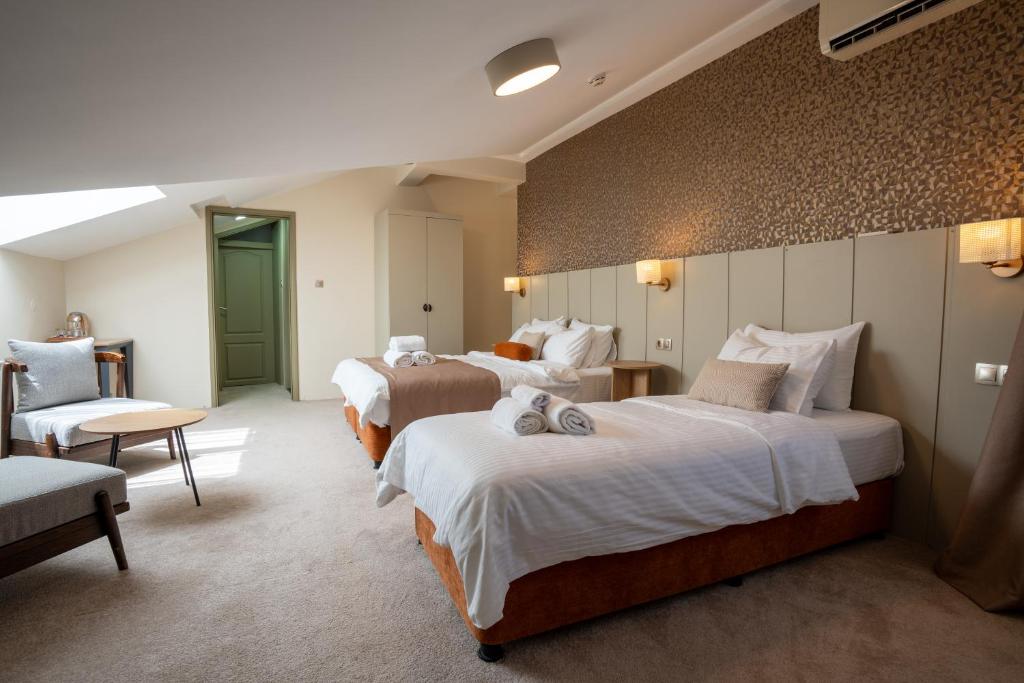 Postel nebo postele na pokoji v ubytování Saffron Boutique Hotel