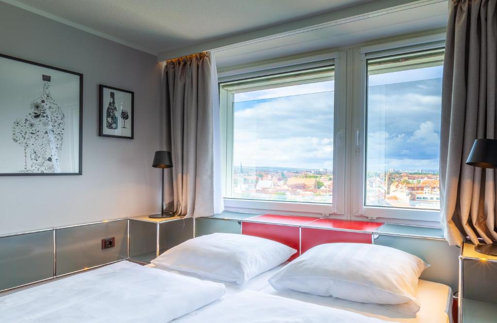 Postel nebo postele na pokoji v ubytování NYX Hotel Erfurt by Leonardo Hotels