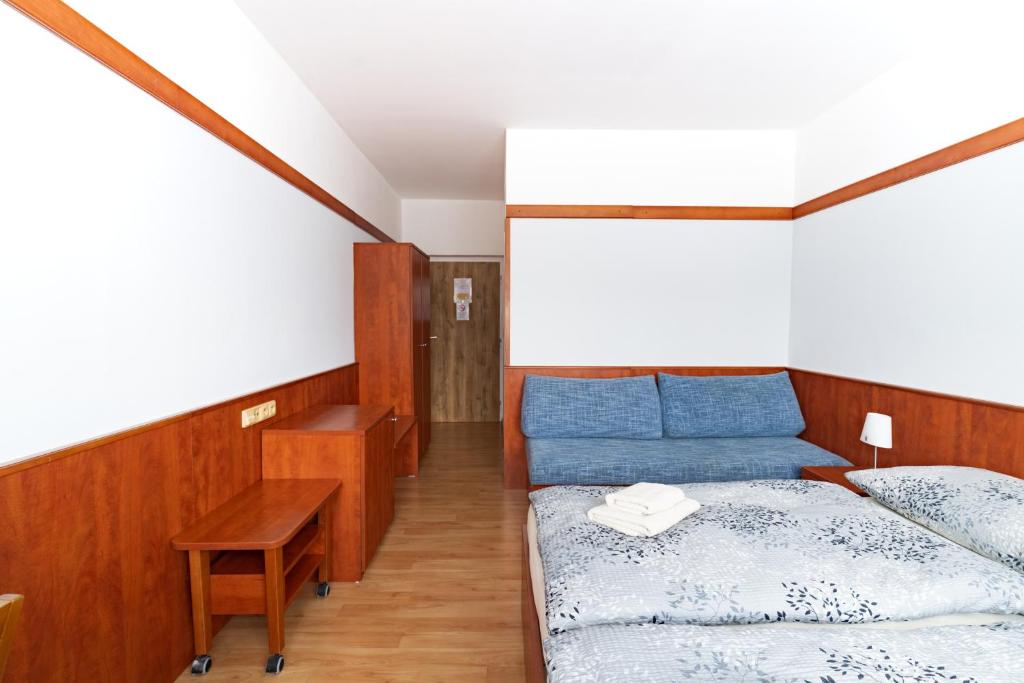 Postel nebo postele na pokoji v ubytování Hotel Macocha