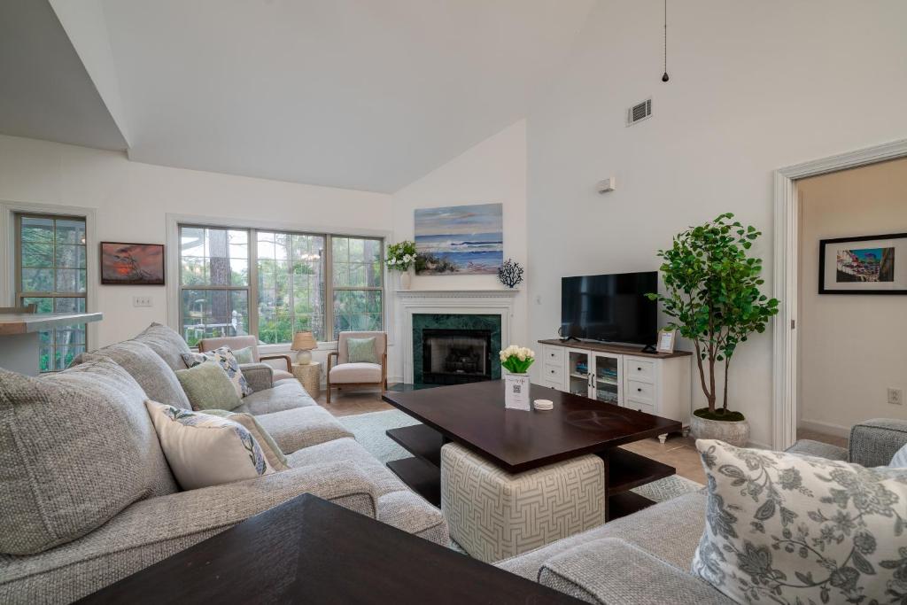 a living room with a couch and a table at 2882 Old Drake in Seabrook Island