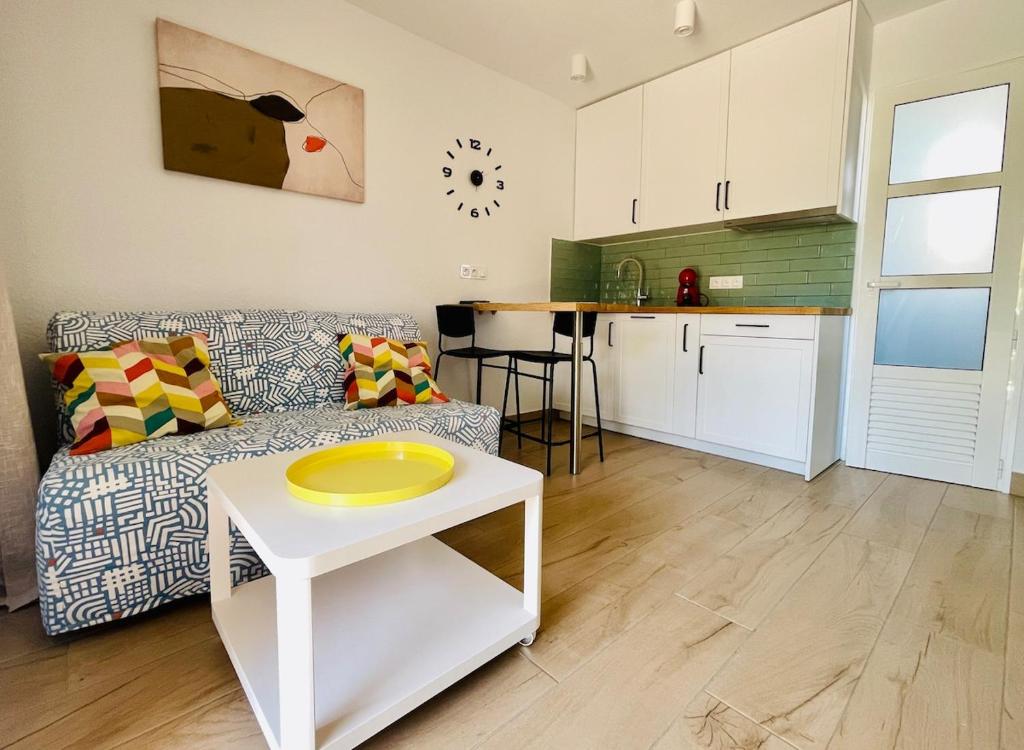 a living room with a couch and a table at F3Sun CASA JACOB - 2 BR, Green Oasis, Costa Calma, Fuerteventura in Costa Calma