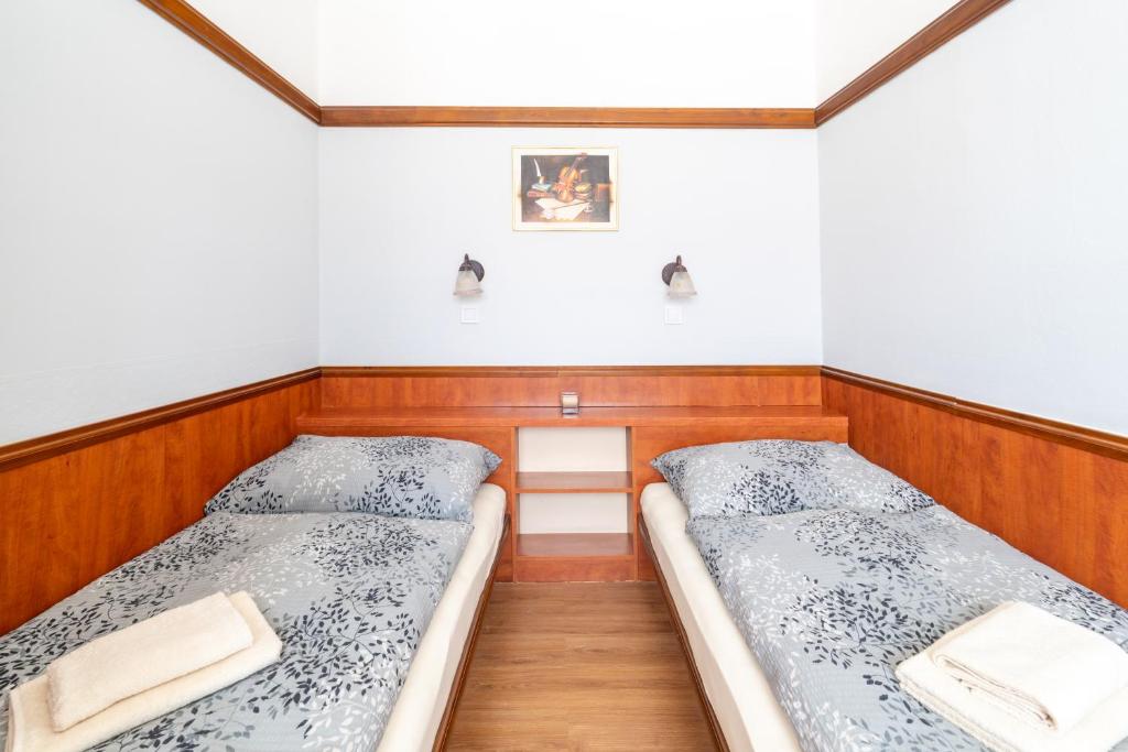 Postel nebo postele na pokoji v ubytování Hotel Macocha