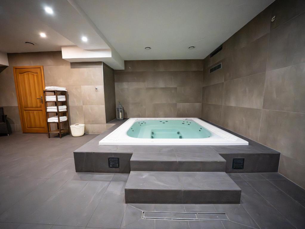 a large bathroom with a jacuzzi tub in a room at Tośka2 Murzasichle in Murzasichle
